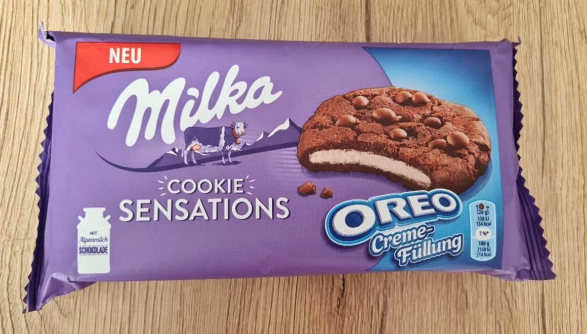 Képek - Milka Cookies Sensations Oreo Creme kakaós keksz tejcsokoládé darabokkal, vaníliás töltelékkel 156 g