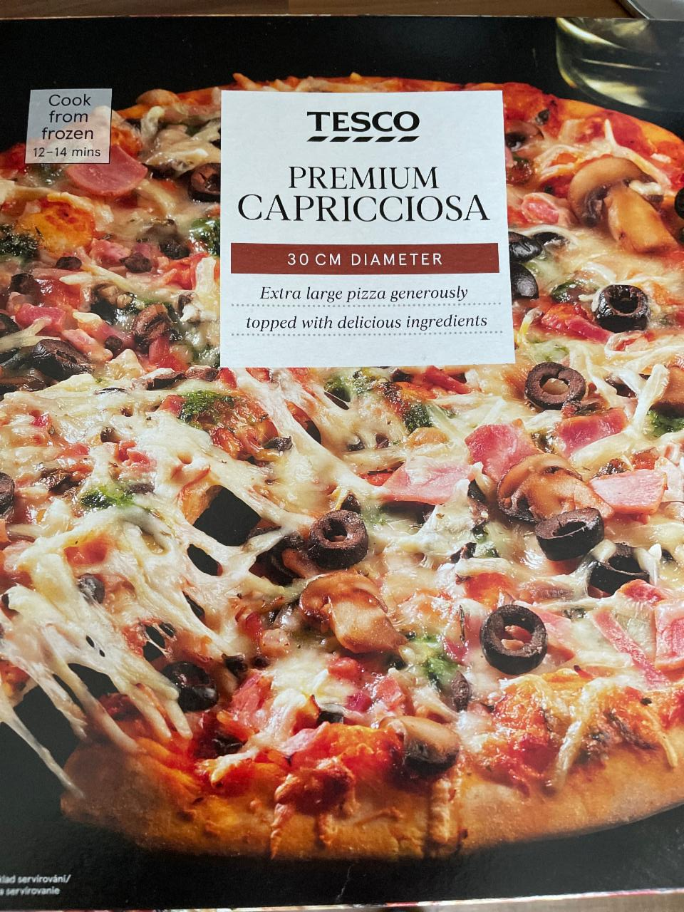 Képek - Tesco premium capricciosa gyorsfagyasztott pizzalap sajttal, sonkával, gombával, olajbogyóval 