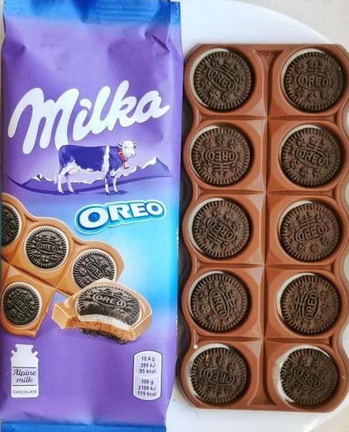 Képek - Milka Oreo Sandwich kakaós kekszek vaníliaízű, tejes krémtöltelékkel alpesi tejcsokoládén 92 g